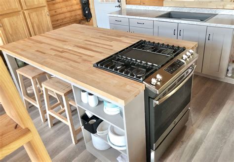 kitchen w a gas stove a fridge on the island